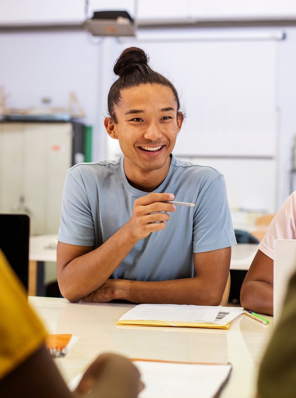 a happy schoolboy looking at the camera
